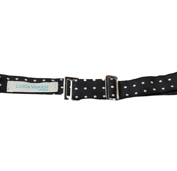 Crossing black bow tie with white dots