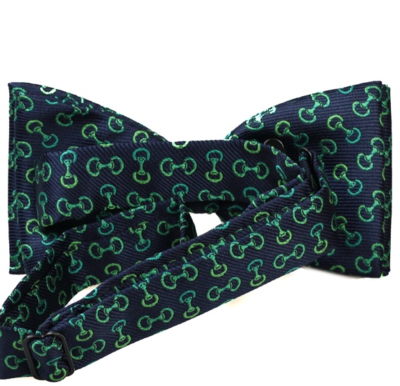 Blue bow tie with green designs riding reverse